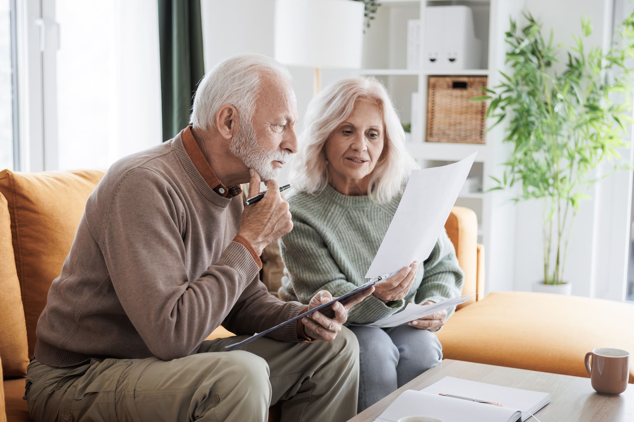Senior couple reviewing documents together