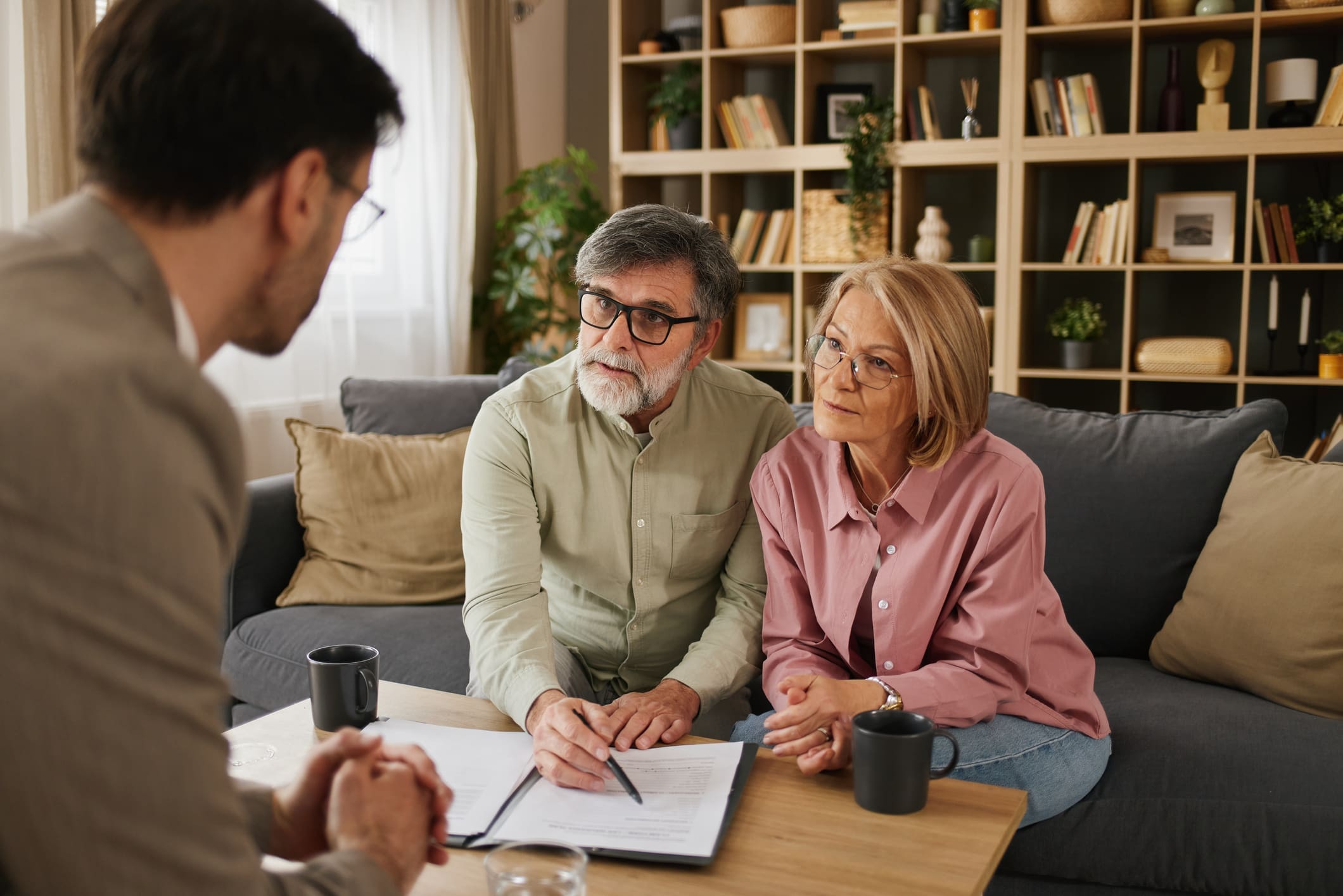 Couple reviewing documents with consultant