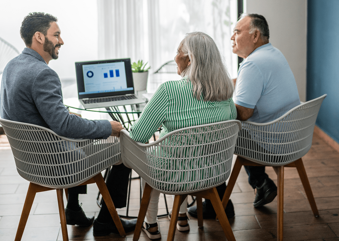 People in meeting around glass table