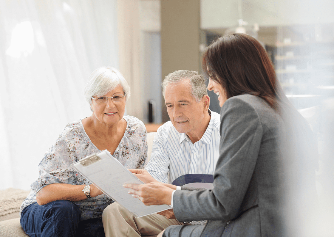 Elderly couple meeting with financial consultant