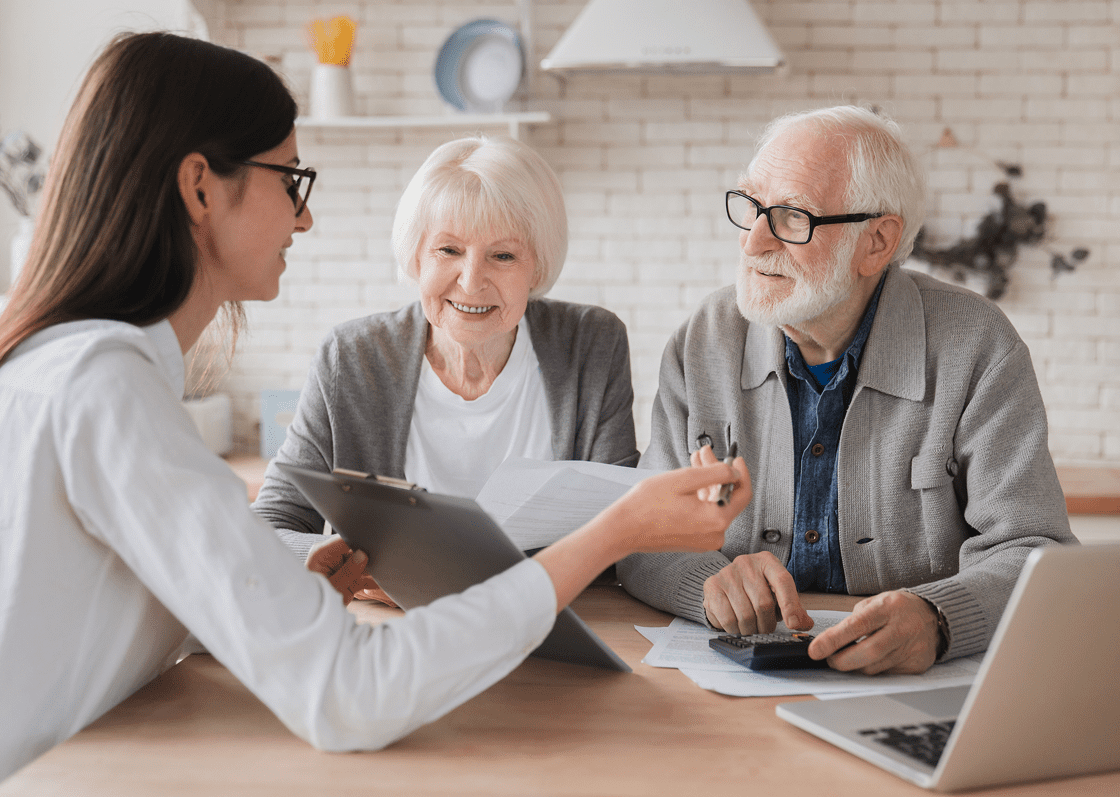 Elderly couple consulting with advisor