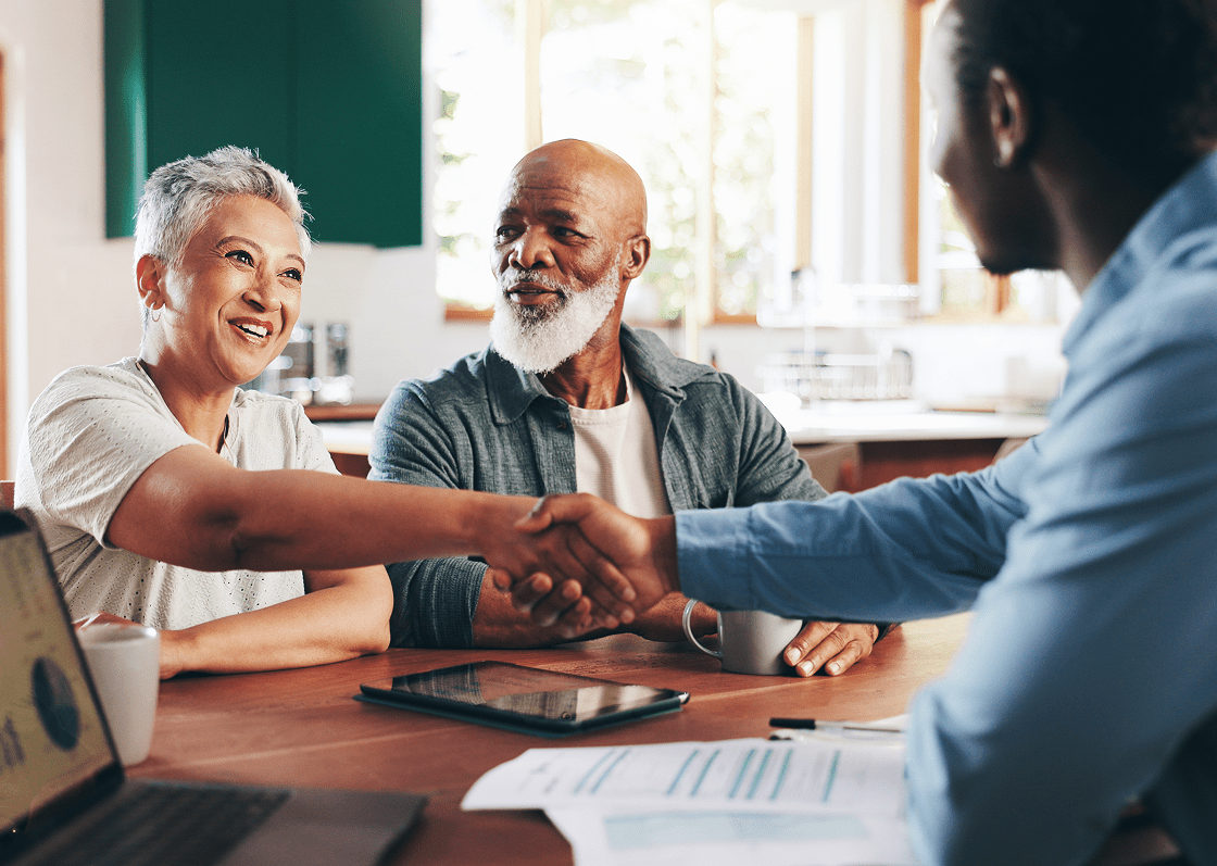 Happy couple meeting with financial consultant