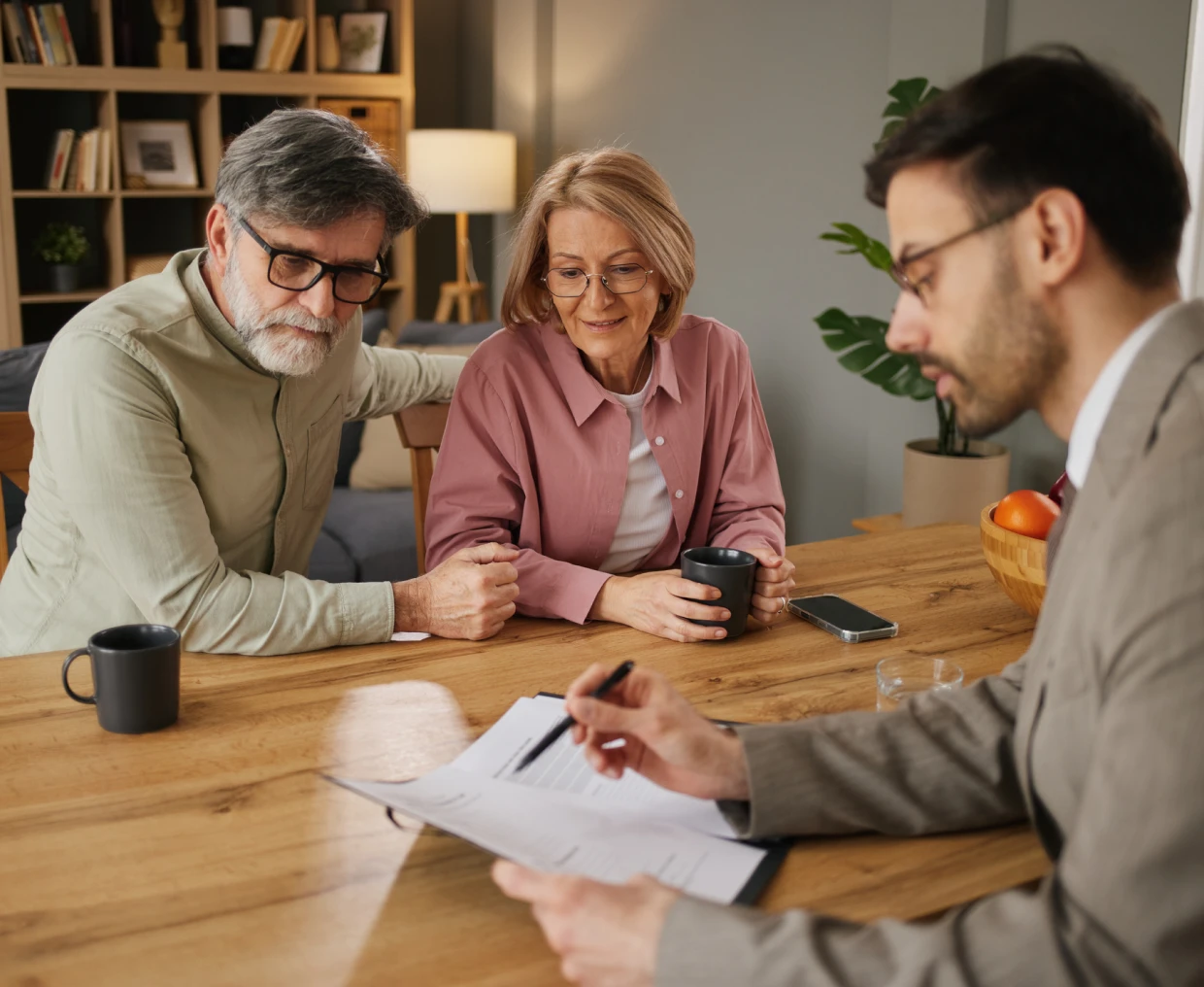 Elderly couple consulting financial expert