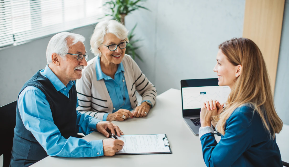 Senior couple consulting financial planner